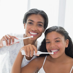 Women brushing their teeth